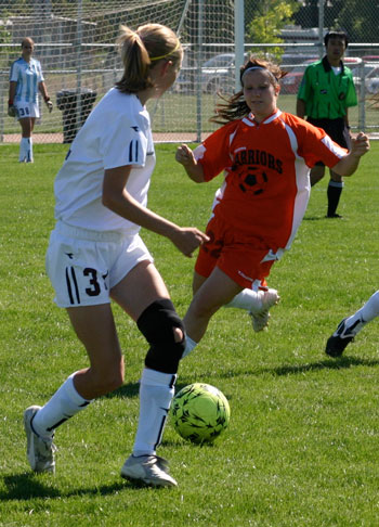 Sports Girl Wears Knee Brace While Playing Soccer